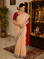 Peach Toned Cotton Saree with Navy Blue Border and Red Blouse